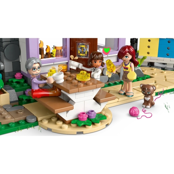 Конструктор LEGO Friends Будиночок і квітник бджолярів, 1161 деталь (42669) - Pampik - 7